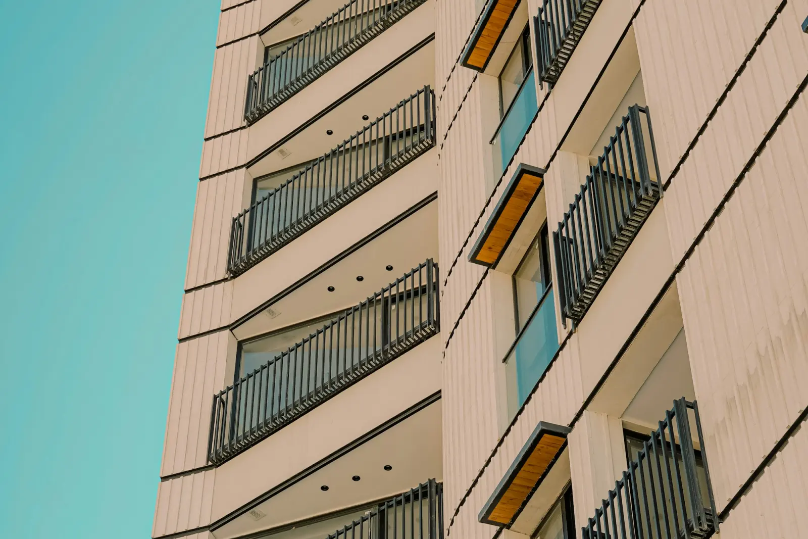 A residential tower photographed against open sky